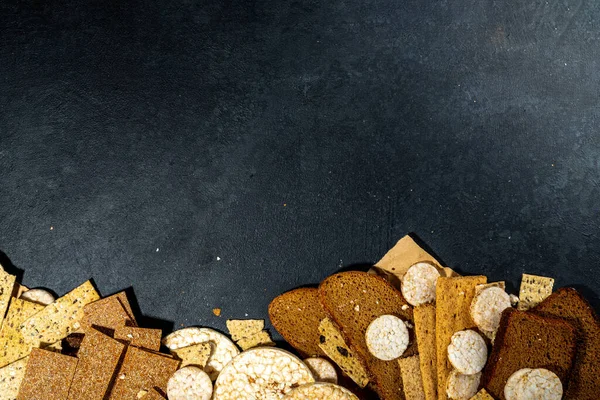 Gluten free allergic diet, celiac disease concept. Collection of various non-gluten different bread, whole grain loaves. Healthy alternative to bread, flatlay copy space