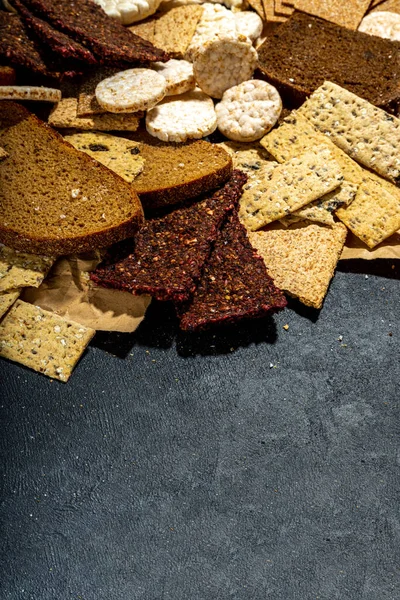 Gluten free allergic diet, celiac disease concept. Collection of various non-gluten different bread, whole grain loaves. Healthy alternative to bread, flatlay copy space