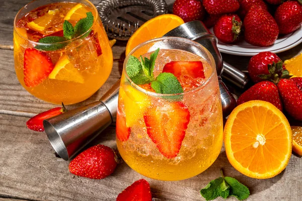 Homemade Summer Sparkling White Wine Sangria. Cold fizz fruit and berry infused alcohol drink, non-alcohol lemonade with fresh strawberry and orange, copy space