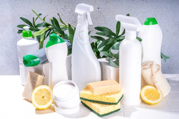 Eco friendly organic cleaning concept. Eco-friendly cleaner utensils - eco brushes, tools sponges, natural cleaning products, soda, soap, lemon, vinegar, bottles with green leaves on white background