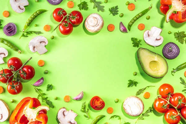 Various fresh vegetables pattern. Raw organic vegetables, salad ingredients bright flatlay on light green background. Healthy diet common diet, vegan vegetarian foodcooking background copy space