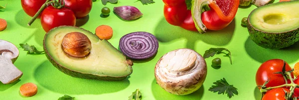 Various fresh vegetables pattern. Raw organic vegetables, salad ingredients bright flatlay on light green background. Healthy diet common diet, vegan vegetarian foodcooking background copy space