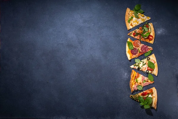 Various taste type pizza pieces with different traditional filling - seafood fish salmon, Hawaiian with chicken, vegetarian vegetable margarita, meat carbonara, salami on dark grey background
