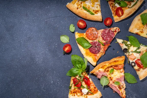 Various taste type pizza pieces with different traditional filling - seafood fish salmon, Hawaiian with chicken, vegetarian vegetable margarita, meat carbonara, salami on dark grey background