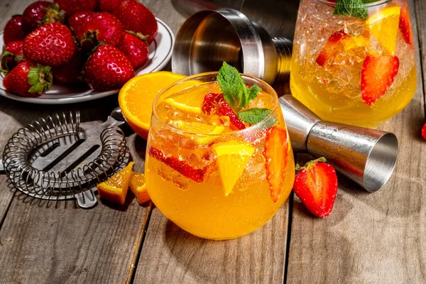 Homemade Summer Sparkling White Wine Sangria. Cold fizz fruit and berry infused alcohol drink, non-alcohol lemonade with fresh strawberry and orange, copy space