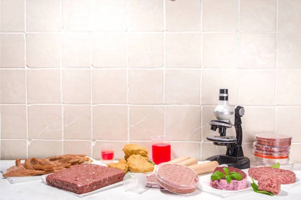 Lab grown meat alternatives concept, Various laboratory grown meat types red and white meat with microscope, laboratory accessories, measuring utensils