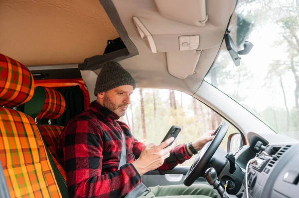 Adventurous Man Using Smart Phone Van — Stock Photo, Image