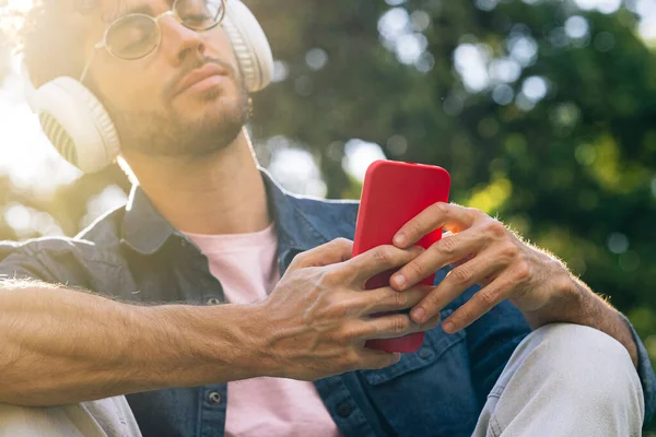 Outdoor Portrait Handsome Young Hipster Man Listening Music Headphones Mobile —  Fotos de Stock