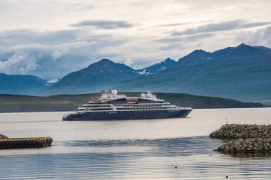 Hrisey, Iceland - August 7. 2021: Cruise ship Le Dumont D'Urville sailing by the coast of island of Hrisey