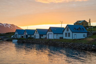 Summer sunset in the village on island of Hrisey in north Iceland