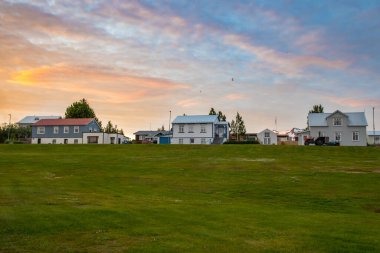 Summer sunset in the village on island of Hrisey in north Iceland