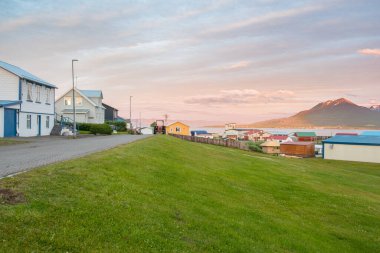 Summer sunset in the village on island of Hrisey in north Iceland