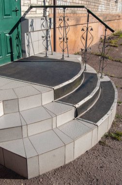 Steps for descent, ascent to the institution on the street.