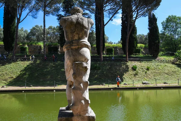 Villa Adriana (Tivoli, Italy) -  Statue of God at the side of pool named Canopus (background of the blue sky)