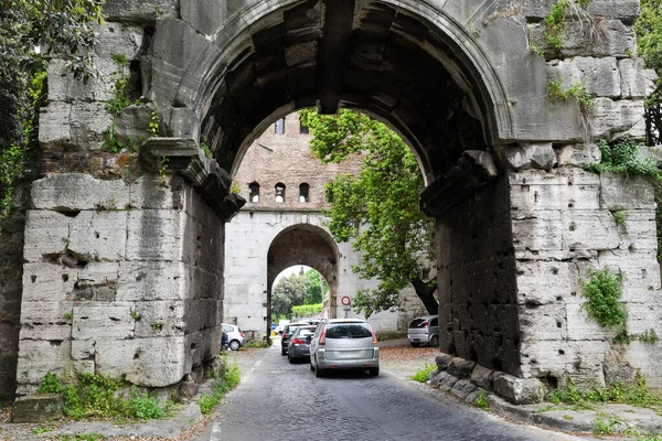 Ancient ruins in Rome (Italy) - Arch of Drusus or part of Aqua Antoniniana (originaly constructed as Arch of Trajana) and Porta San Sebastiano (Porta Appia), Gate on Via Appia (Appian Way)