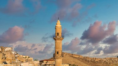 Mardin, Turkey - January 2020: Sehidiye mosque minarette in old City Mardin, Turkey