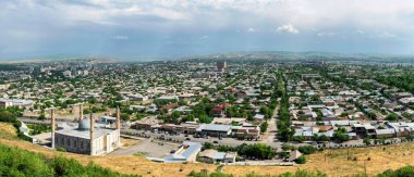 Osh, Kyrgyzstan - May 2022: Osh cityscape as seen from Suleiman mountain. Osh is the second largest city in Kyrgyzstan, located in the Fergana Valley in the south of the country