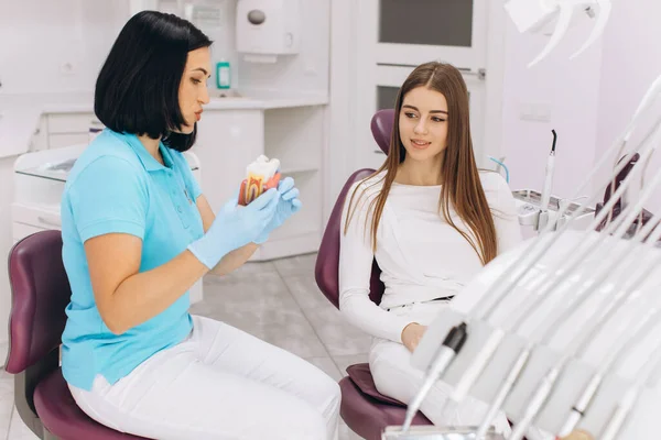 Girl Sitting Dental Chair Visit Female Dentist Showing Caries Model — Stock Photo, Image