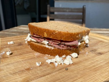 Roast Beef Sandwich with Toast Bread on Wooden Board. Ready to Eat.