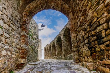 Castellar de la Frontera, Spain - 9 March, 2022: castle gate and walls in the historic city center of Castello de Castellar clipart