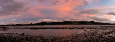 panorama view of the Clyde River near Dumbarton at low tide at sunset