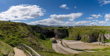 A panorama view of the landmark Smoo Cave on the coast of the northwestern Scottish Higlands