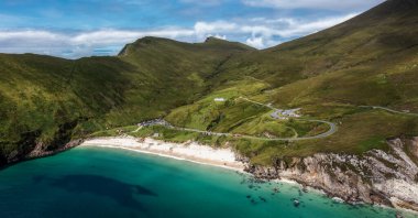View of the winding clifftop road leading to picturesque Keem Bay and beach on Achill Island in County Mayo in western Ireland