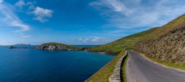 panorama landscape with Wild Atlantic Way coastal road leading to Slea Head on Dingle Peninsula in County Kerry of western Ireland