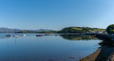 Bantry, Ireland -12 August, 2022: many sailboats anchored in the calm waters of Bantry Bay on the outskirts of Bantry village