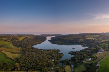 A view of Castlehaven Bay and Rineen Woods in West Cork in warm evening light