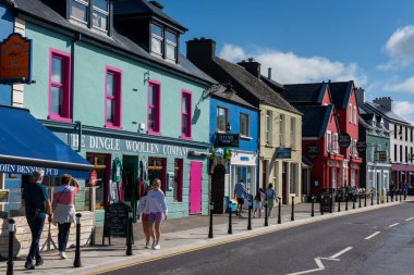 Dingle, Ireland - 7 August, 2022: colorful houses on the main street of picturesque Dingle village in County Kerry