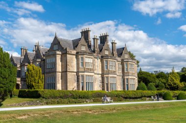 Muckross, Ireland - 10 August, 2022: view of the Muckross manor house in Killarney National Park in County Kerry of western Ireland