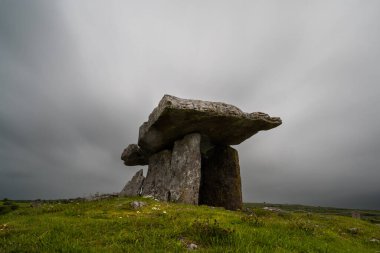 A long exposure view of the Poulnabrone Dolmen under an overcast sky in County Clare of Western Ireland