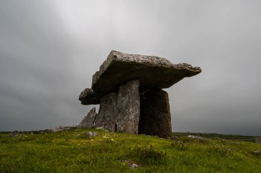 A long exposure view of the Poulnabrone Dolmen under an overcast sky in County Clare of Western Ireland