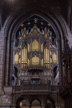 Chester, United Kingdom - 26 August, 2022: close-up view of the church organ and pipes in the central nave of the historic Chester Cathedral in Cheshire