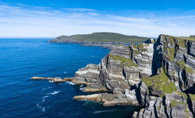 A view of the Kerry Cliffs and Iveragh Peninsula in County Kerry of Ireland