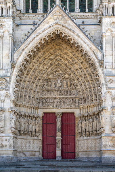 Amiens, France - 12 September, 2022: close-up view of the main door of the West Portal of the Amiens Cathedral