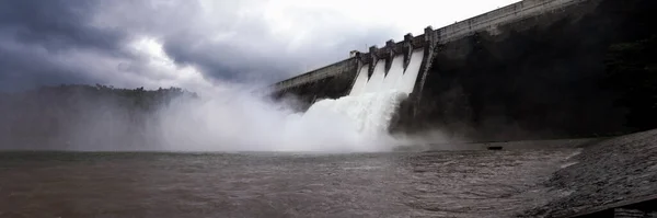 Overview of open the drainage through the dam spillway after full water to River Outlet in Panorama, Roller Compacted Concrete Structure, RCC Dam, Dam Safety and control for Flood watch out