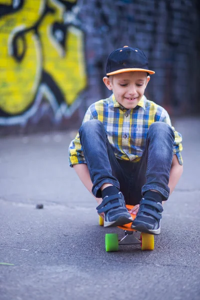 Boy Rides Sitting Skateboard Child Walk City Background Graffiti Walls — Stock Photo, Image