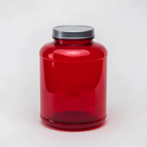 Velká Červená Průhledná Plastová Lahvička Bílém Pozadí Izolované — Stock fotografie