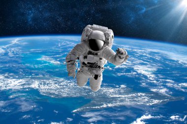 Dünya 'nın dış uzayındaki astronot. Yıldızlar arka planı sağlar. Dünya' nın üzerinde bir uzay oluşturur. Bu görüntünün ISS elementleri NASA tarafından desteklenmektedir.