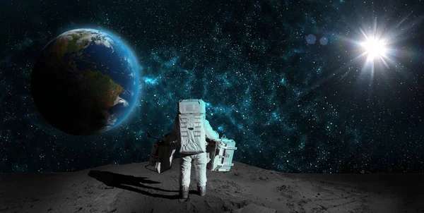 Astronaut on rock surface moon in space. Spacewalk.Astronaut standing looking at the Earth on lunar moon landing mission.Nebula,sun,planet.Elements of this image furnished by NASA.3D illustration.