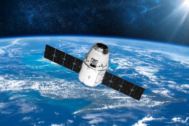 Kargo uzay aracı ve Dünya gezegeni. Karanlık arka plan. Bilim kurgu duvar kağıdı. Dünya 'nın yörüngesindeki uzay istasyonu. Uzay gemisi. Uzay sanat duvar kağıdı. Güneş Gözlemevi. Bu görüntünün elementleri NASA tarafından döşenmiştir.