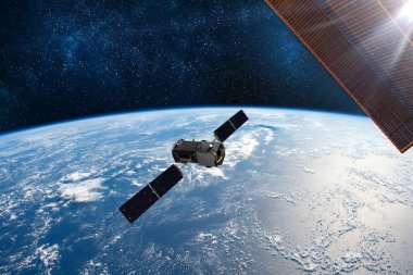 Kargo uzay aracı Dünya gezegeni. Karanlık arka plan. Bilim kurgu duvar kağıdı. Uzay İstasyonu Dünya 'nın yörüngesindeki uzay gemisi. Uzay sanat duvar kağıdı. Güneş Gözlemevi. Bu görüntünün unsurları NASA3D illüstrasyon tarafından desteklenmektedir..