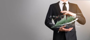 Grafik büyümesi ve işletmelerinde grafik pozitif göstergelerin artması işadamı. Yatırım konsepti. Satış verileri ve ekonomik, strateji ve planlama, Dijital pazarlama ve borsa analizi..