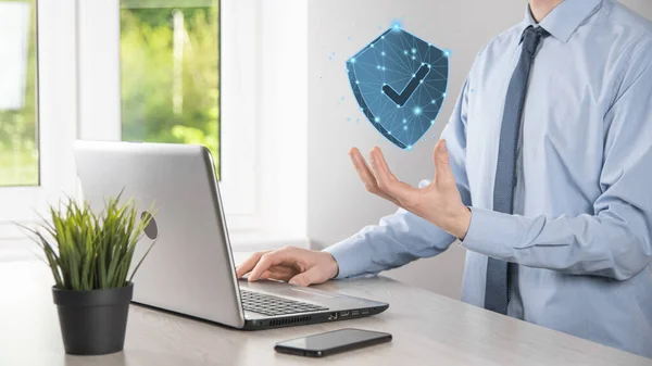 Businessman hold low poly polygon shield with a tick icon.Secure Access System Concept.Business Financial Warranty for Investment.antivirus concept.Technology security.Protection network,safe data