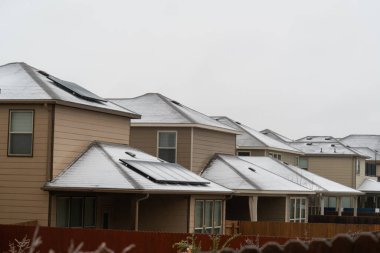 view of snow covered rooftops on houses