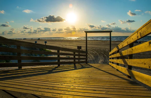Sandy Dunes build on Padre Island , Texas , a Beach Destination Vacation on the Barrier Island with Sea Oats and Pathway to the Gulf of Mexico