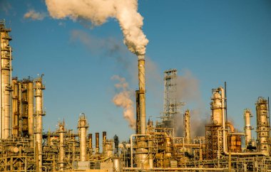 smoke stacks emitting carbon pollution into the sky causing climate change