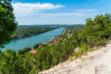  summer landscape mount Bonnell views of colorful rooftops and mansions in nature in Austin , Texas , USA clipart
